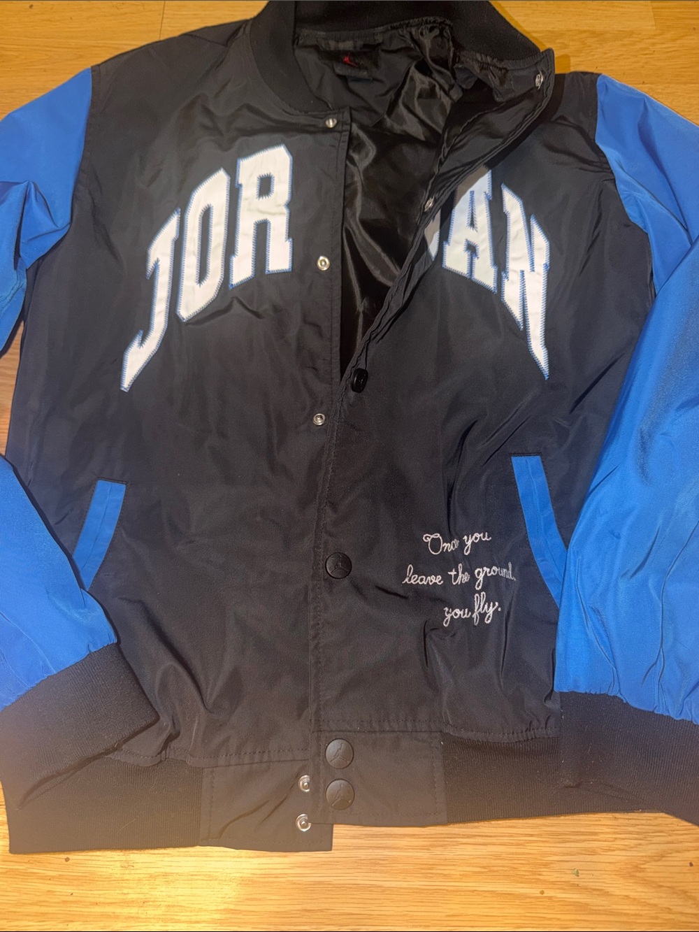 Jordan Black Jacket with Blue Sleeves and White Appliqué